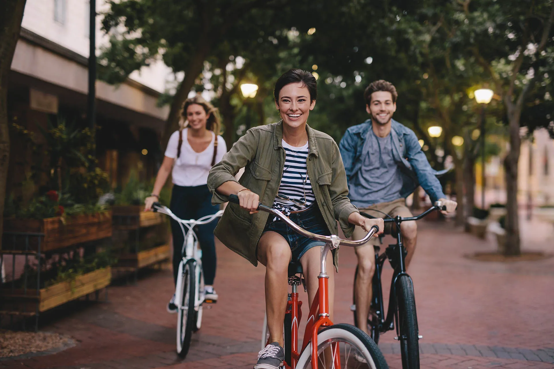three friends on bicycles